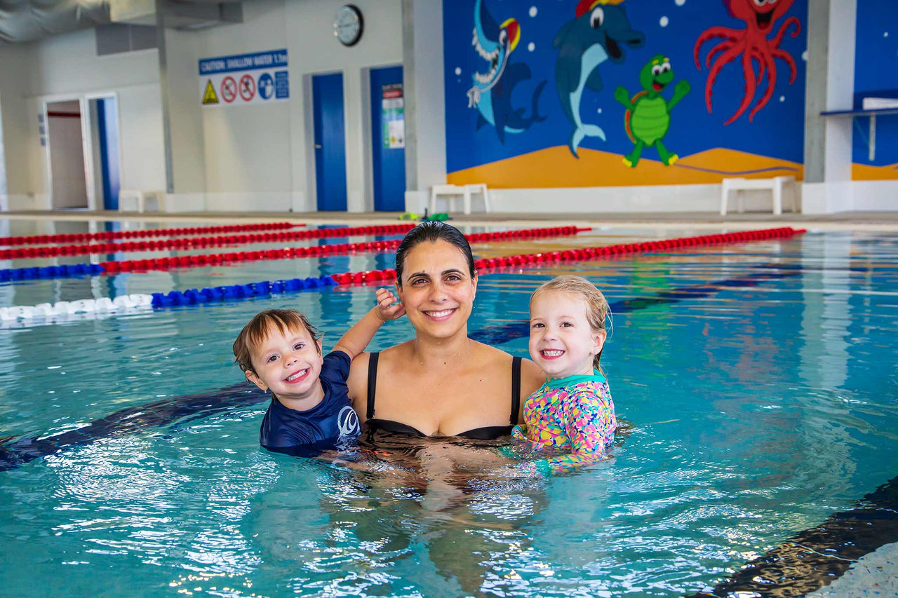 Mother with 2 children in indoor pool at Sandgate Aquatic Centre.