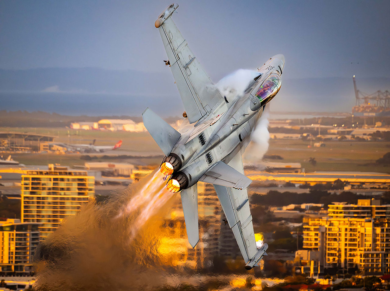 LMPA 2026 Peoples Choice Finalist - Xavier Montaner - Riverfire Excitement. An Australian Air Force fighter jet in flight over Brisbane City.
