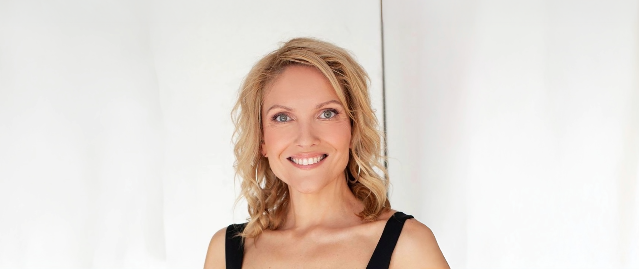 A landscape portrait of Renee Suttie on a white background.