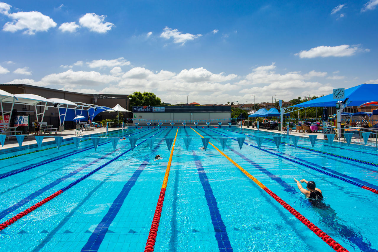 Mid-section image of outdoor pool with a number of people lap swimming at Langlands Park Memorial Pool.