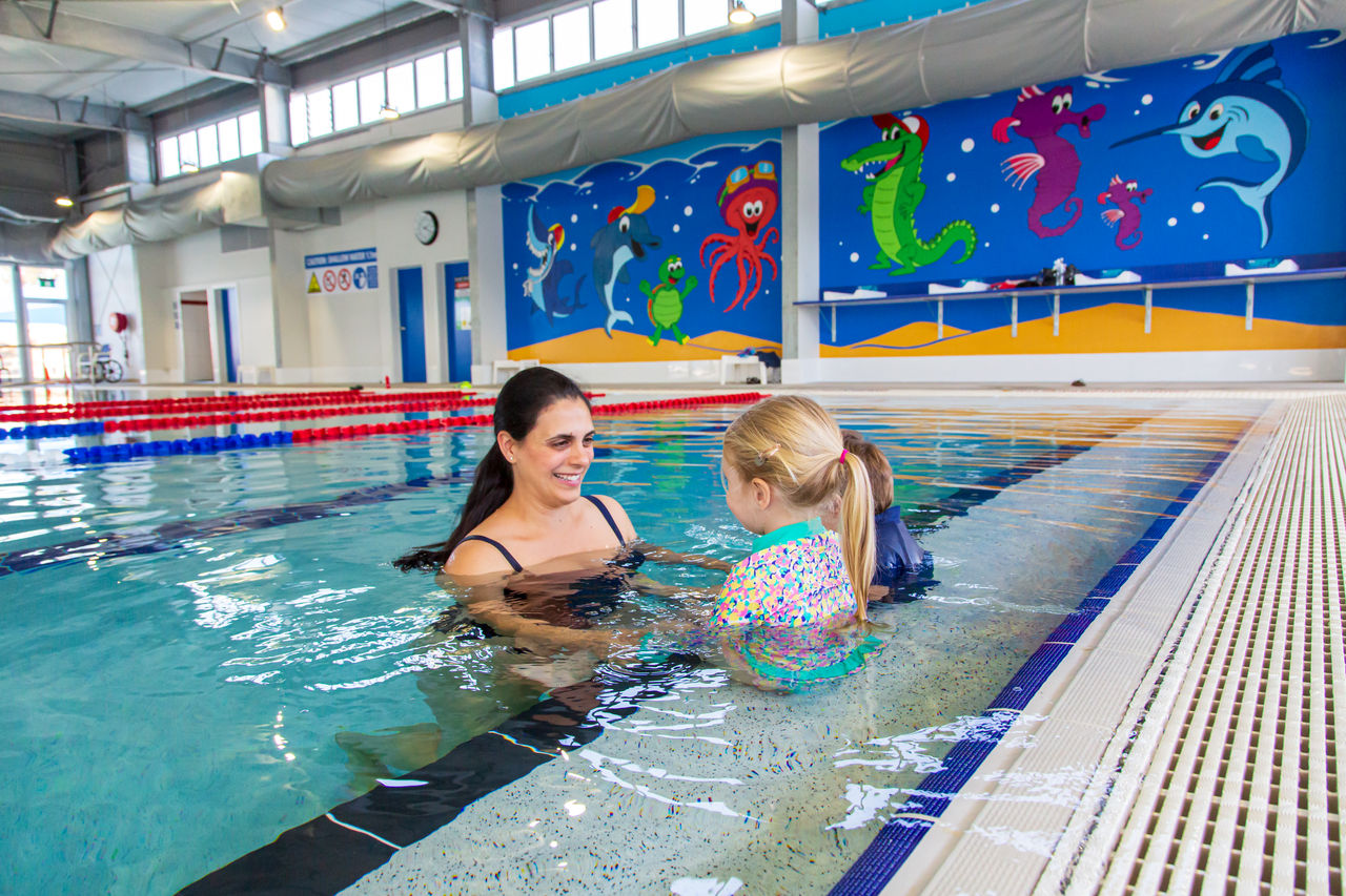 Kids playing in water play area at Newmarket Olympic Swimming Pool.